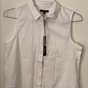 White sleeveless top with sheer embroidered bottom